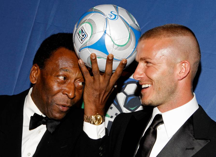 Brazilian soccer great Pele, and English soccer star David Beckham pose for photos during a U.S ...