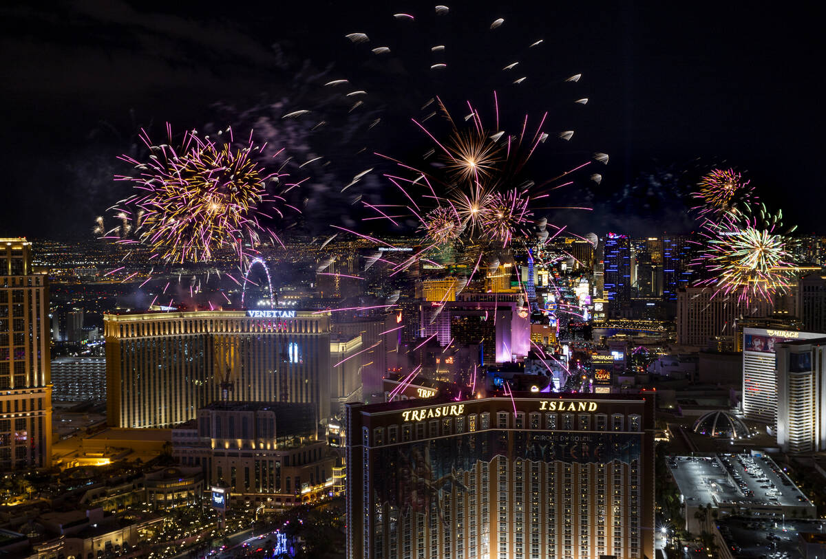 Fireworks explode over the Las Vegas Strip during New Year’s Eve celebrations on Saturday, Ja ...