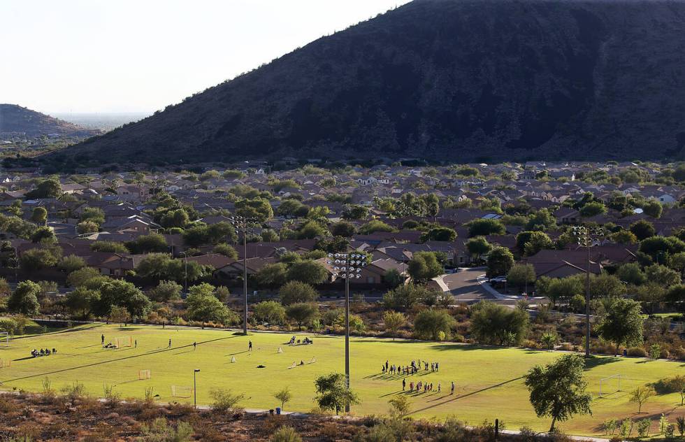 Landscaped yards and green grassy playing fields typify the suburbs of North Phoenix, Oct. 10, ...