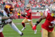 San Francisco 49ers quarterback Brock Purdy (13) scrambles in the second half of an NFL footbal ...
