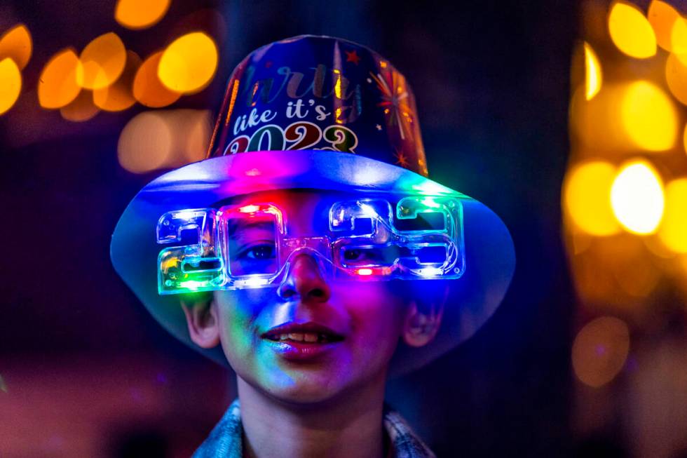 Max Agi, 10, is festive with hat and shade while visiting with his family from Baja, Mexico, on ...