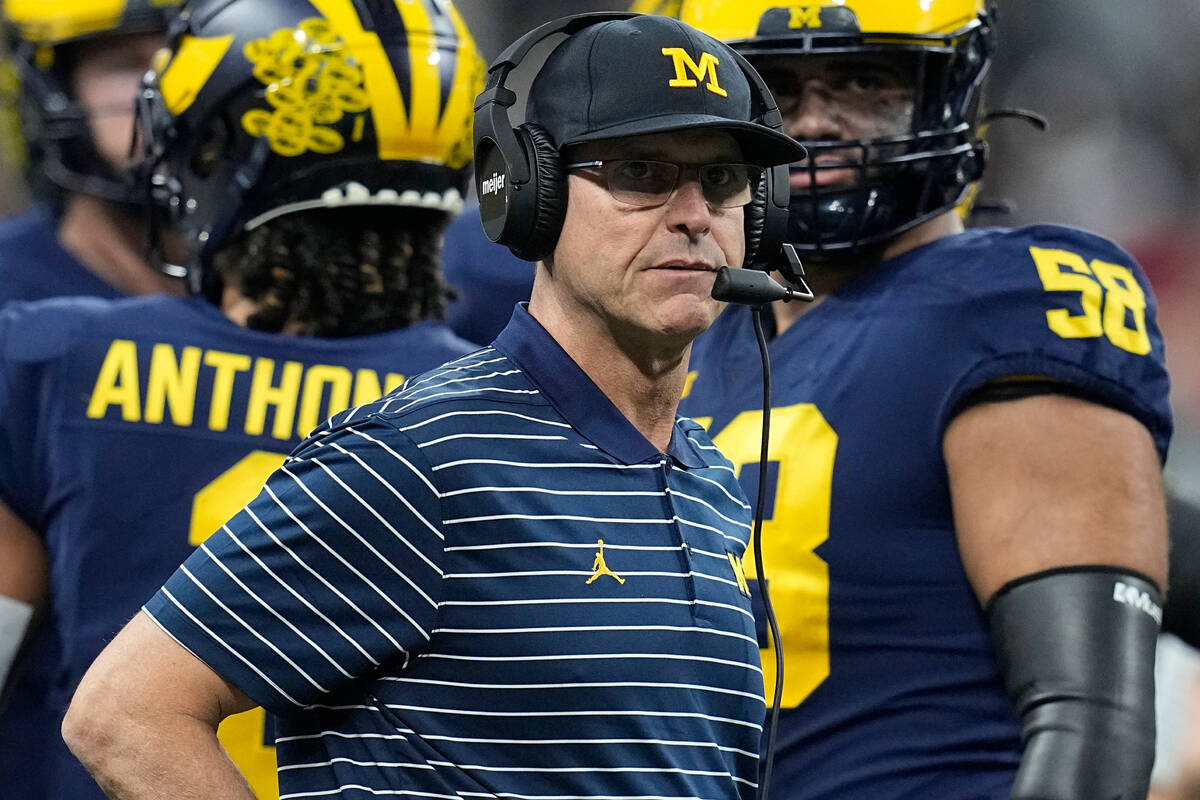 Michigan head coach Jim Harbaugh watches from the sidelines during the first half of the Big Te ...