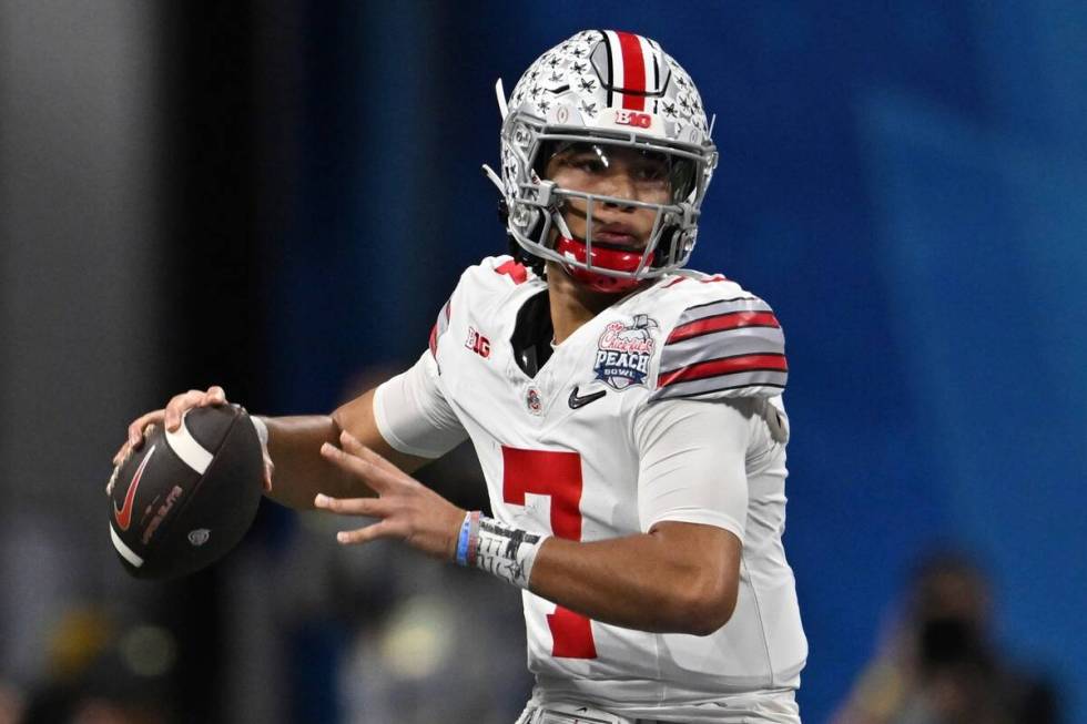 Ohio State quarterback C.J. Stroud (7) passes against Georgia during the first half of the Peac ...