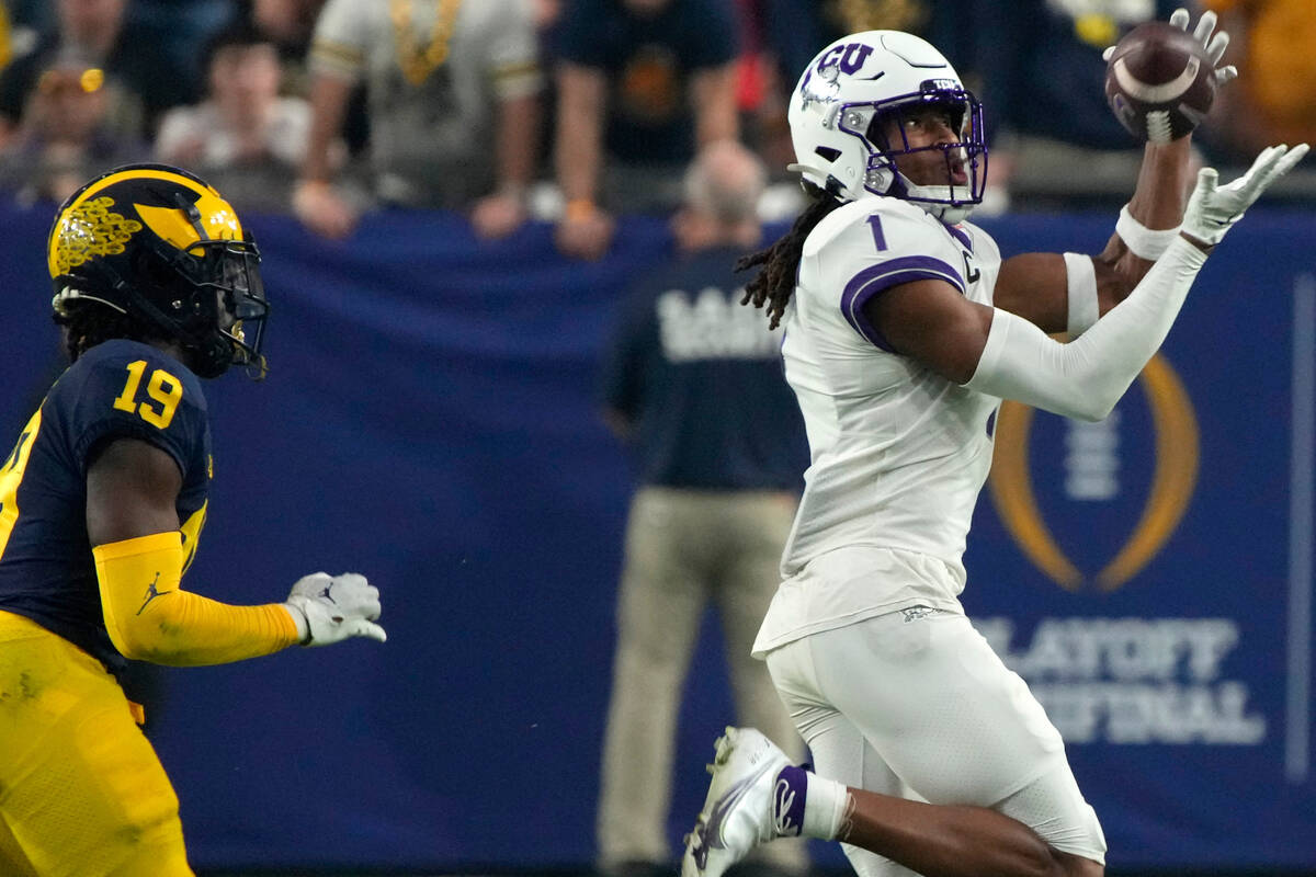 TCU wide receiver Quentin Johnston (1) makes a catch against Michigan during the second half of ...