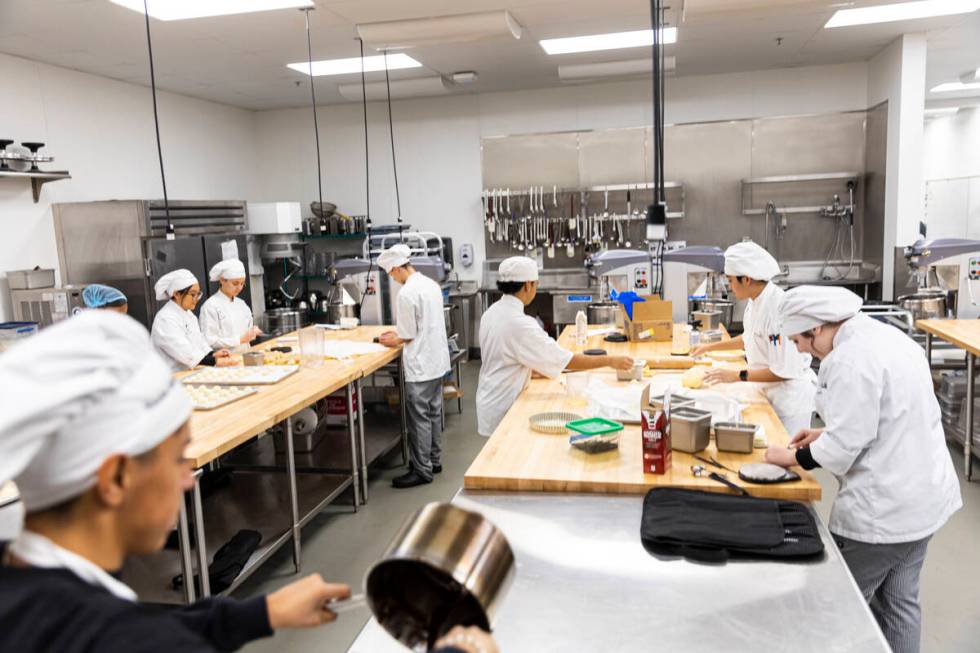 Southeast Career Technical Academy culinary students prepare bread rolls in the kitchen on Tues ...