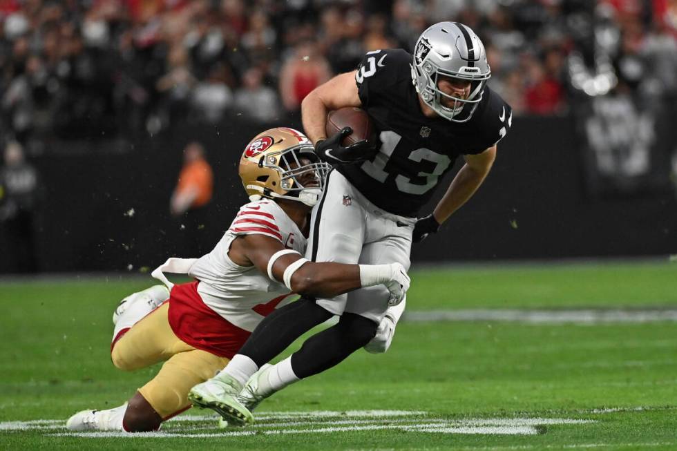 Las Vegas Raiders wide receiver Hunter Renfrow (13) is tackled by San Francisco 49ers cornerbac ...