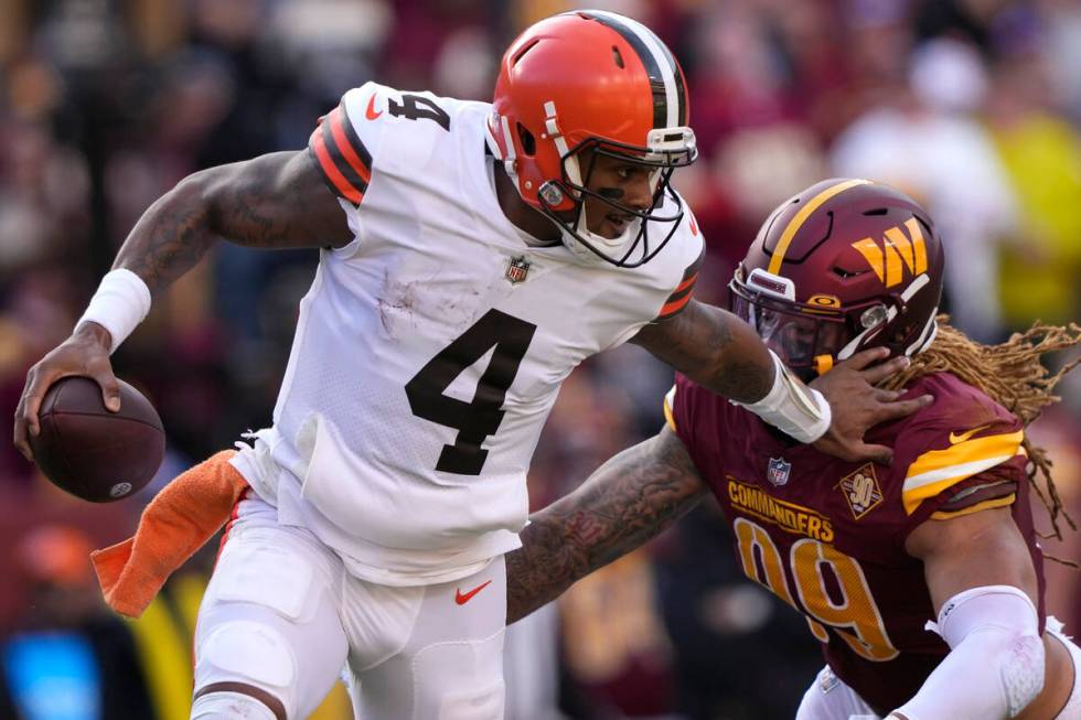 Cleveland Browns quarterback Deshaun Watson (4) gets away from Washington Commanders defensive ...