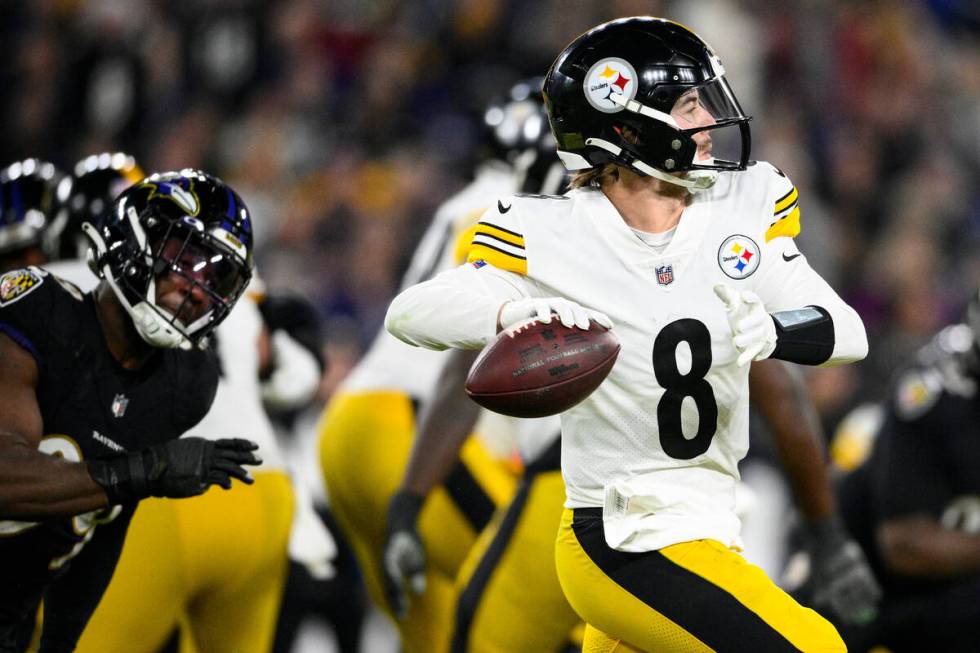 Pittsburgh Steelers quarterback Kenny Pickett (8) throws against the Baltimore Ravens in the fi ...