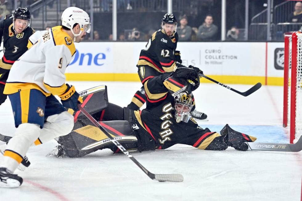 Vegas Golden Knights goaltender Logan Thompson (36) defends his goal against Nashville Predator ...