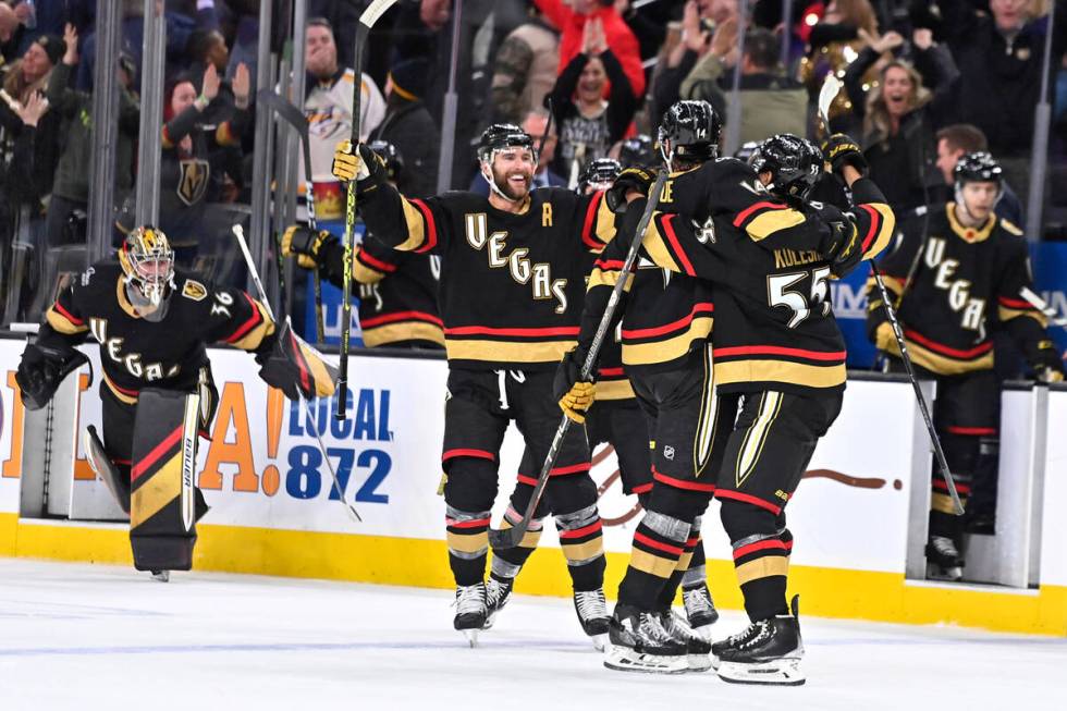 The Vegas Golden Knights celebrate after defeating the Nashville Predators in overtime of an NH ...