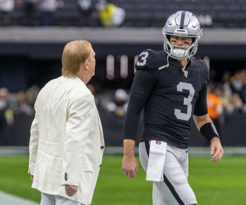 Raiders owner Mark Davis, left, shares a word with Raiders quarterback Jarrett Stidham (3) befo ...