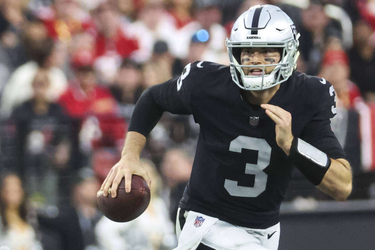 Raiders quarterback Jarrett Stidham (3) runs the ball during the first half of an NFL game agai ...