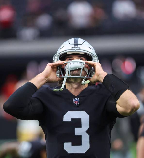 Raiders quarterback Jarrett Stidham (3) puts his helmet on before an NFL game against the San F ...