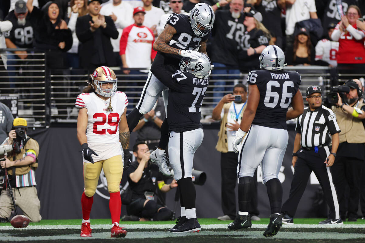 Raiders tight end Darren Waller (83) celebrates his touchdown catch with offensive tackle Thaye ...
