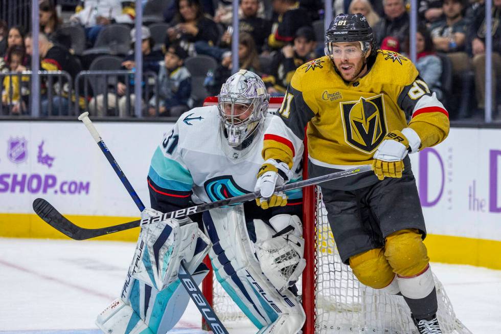 Golden Knights center Jonathan Marchessault (81) reacts to the puck as Seattle Kraken goaltende ...