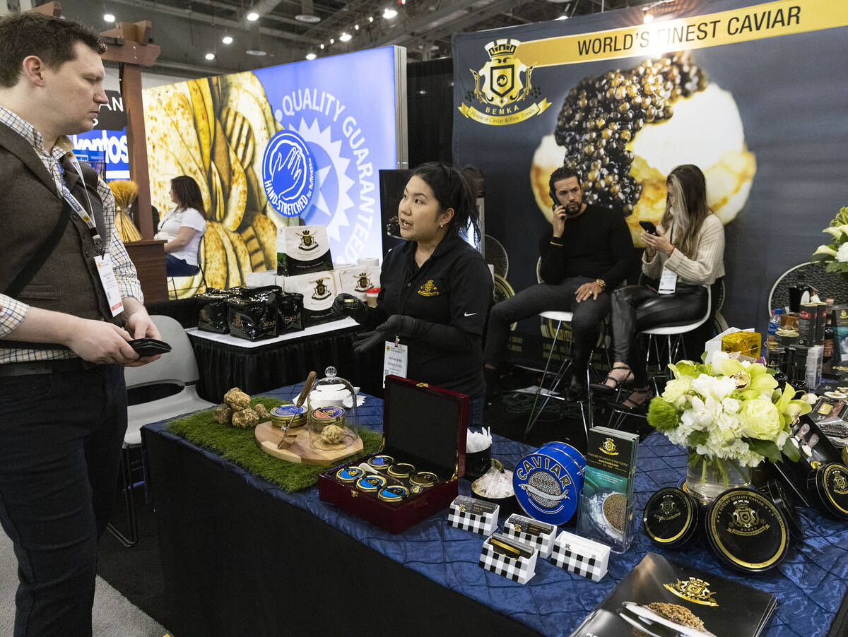 Nathaly Ng of Bemka Corp., center, speaks to a potential buyer at Bemka Corp. booth during Fanc ...