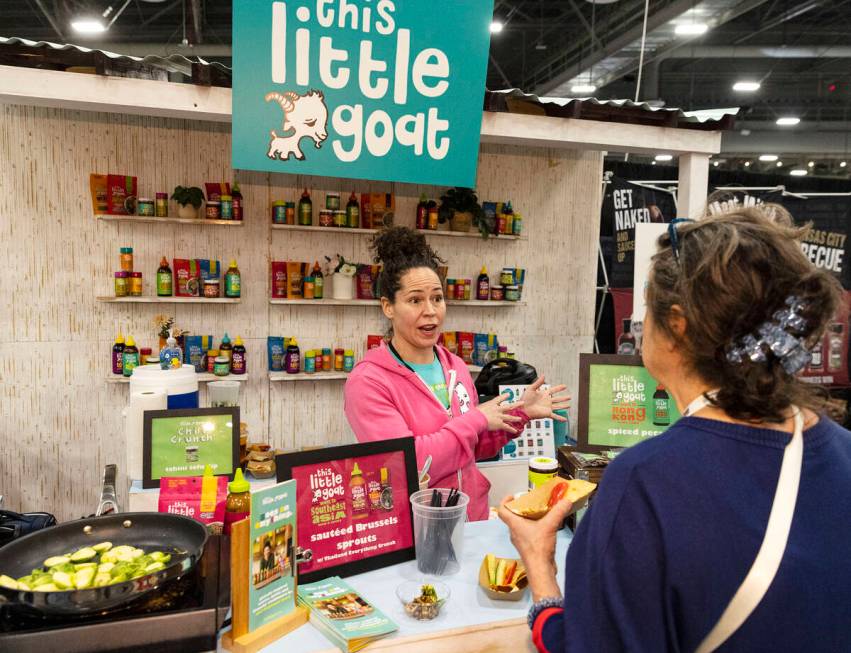 Chef Stephanie Izard talks to a potential buyer at her Little Goat booth during Fancy Food Show ...