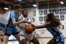 Shadow Ridge’s Jada Livingston (15) loses control of the ball to Centennial’s Try ...