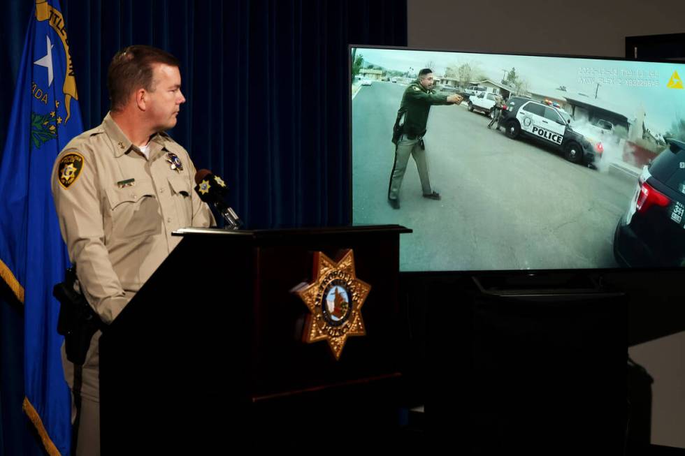 Las Vegas police Assistant Sheriff James Seebock shows body worn camera video during briefing a ...