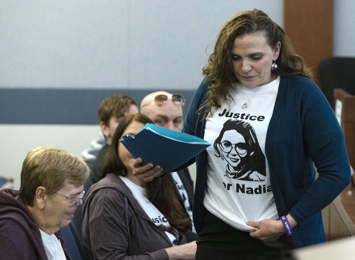 Marie Coker, the sister of Nadia Iverson, a shooting victim, prepares to deliver her victim imp ...