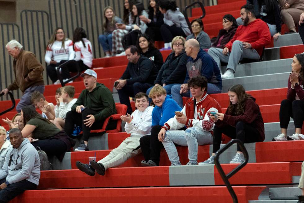 The Arbor View fan section gives mild applause after their team won a boys high school basketba ...