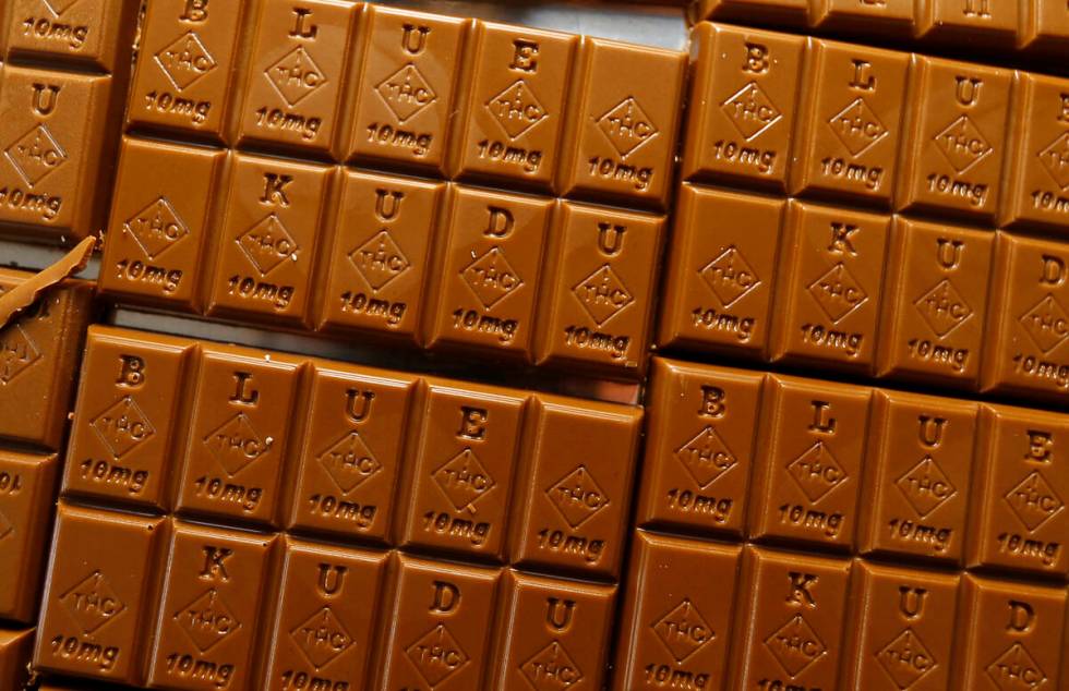 Candy bars marked with Colorado's new required diamond-shaped stamp noting that the product con ...