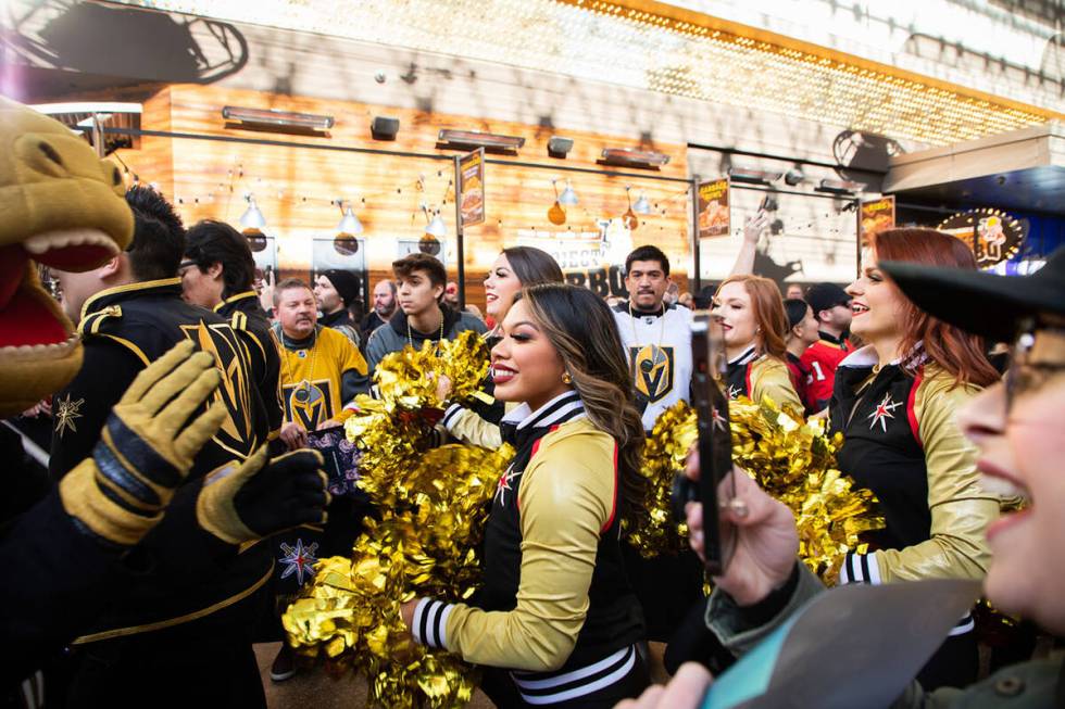 The Vegas Vivas walk down the red carpet during the Las Vegas Golden Knights Fan Fest at the Fr ...