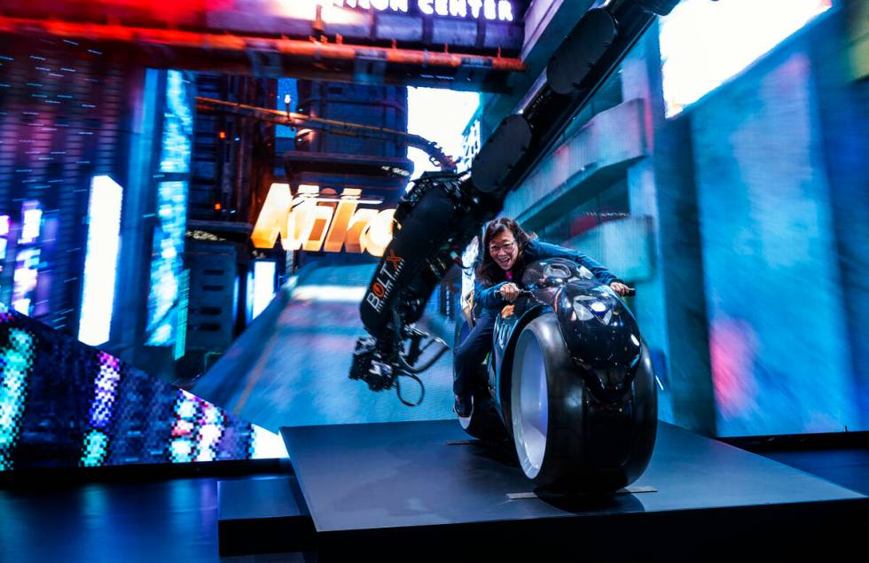 Attendee Maureen Chun sits atop a stagnant motorcycle while filmed by the Nikon Z9 at their Unr ...