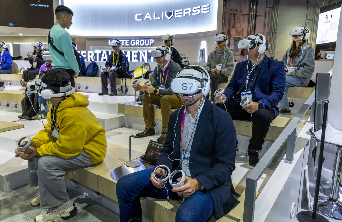 Attendees try out the T!ve by Caliverse virtual system during the opening day of CES 2023 at t ...