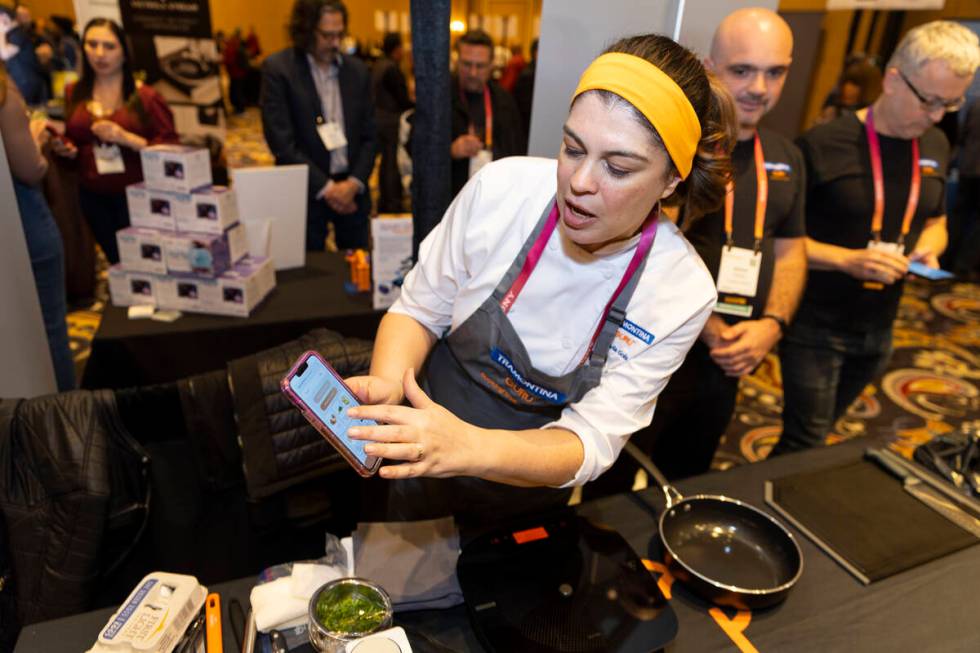 Chef Flavia Gols gives a demonstration of the Tramontina Guru cooktop during the CES ShowStopp ...