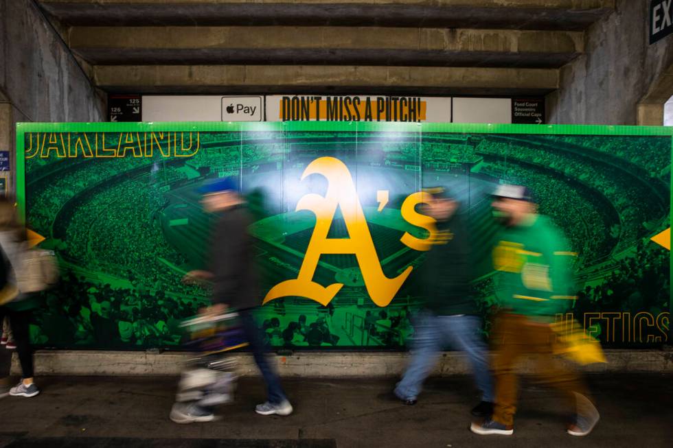 Oakland Athletics fans walk the concourse before the opening night game against the Baltimore O ...