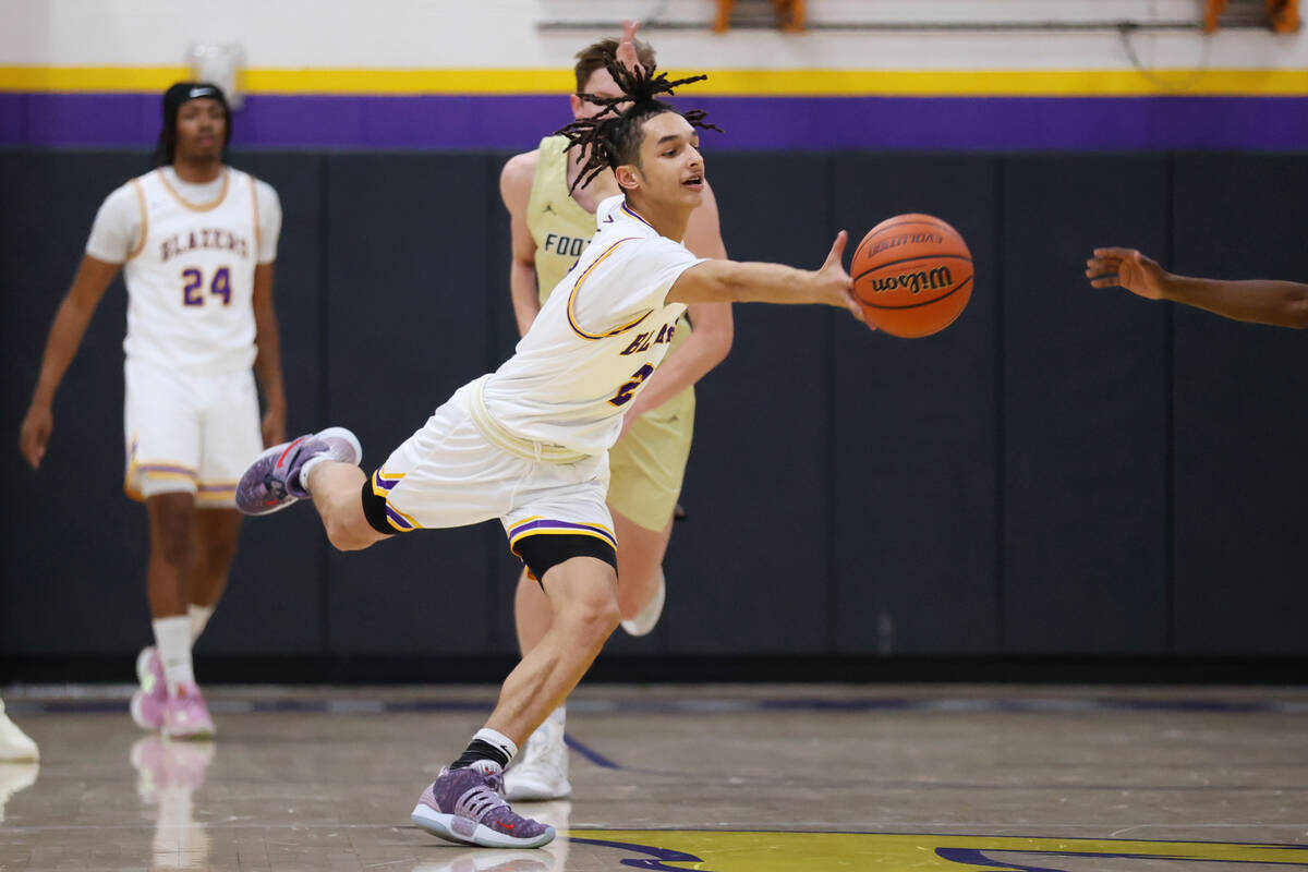 Durango's Mason Brown (2) fights for a loose ball during a boy's basketball game against Foothi ...