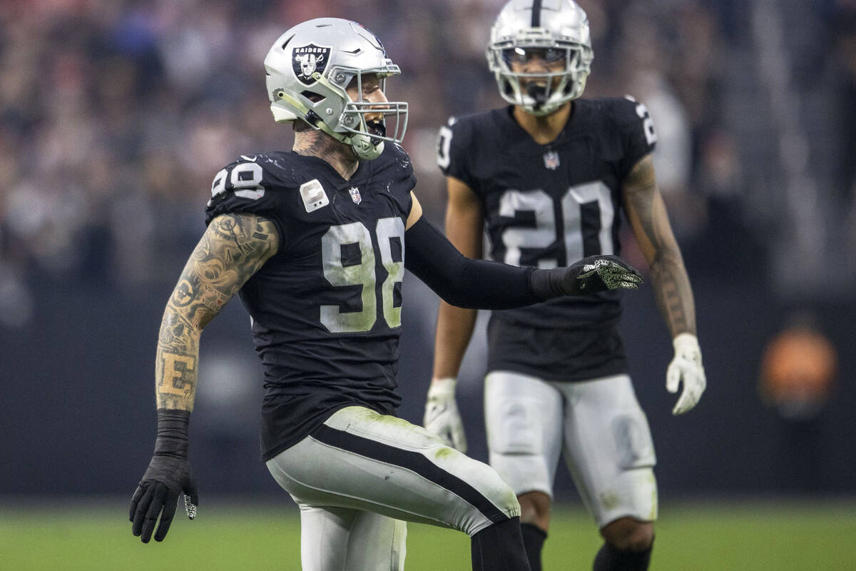 Raiders defensive end Maxx Crosby (98) celebrates a sack during the second half of an NFL game ...