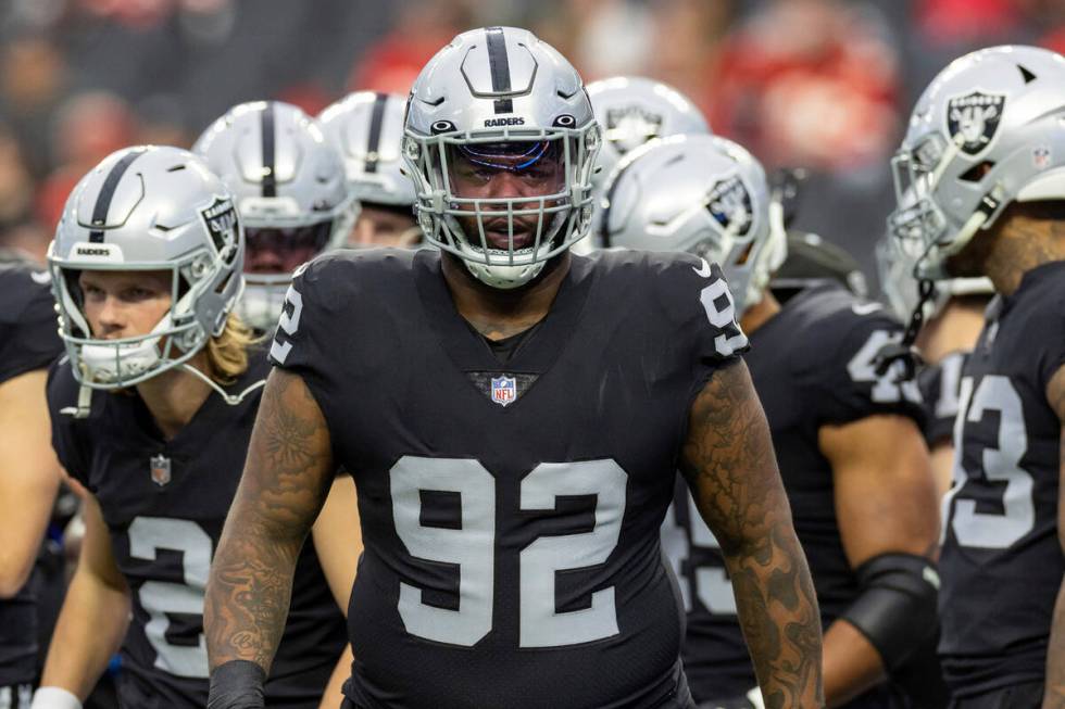 Las Vegas Raiders defensive tackle Neil Farrell, Jr. (92) warms up before playing against the K ...