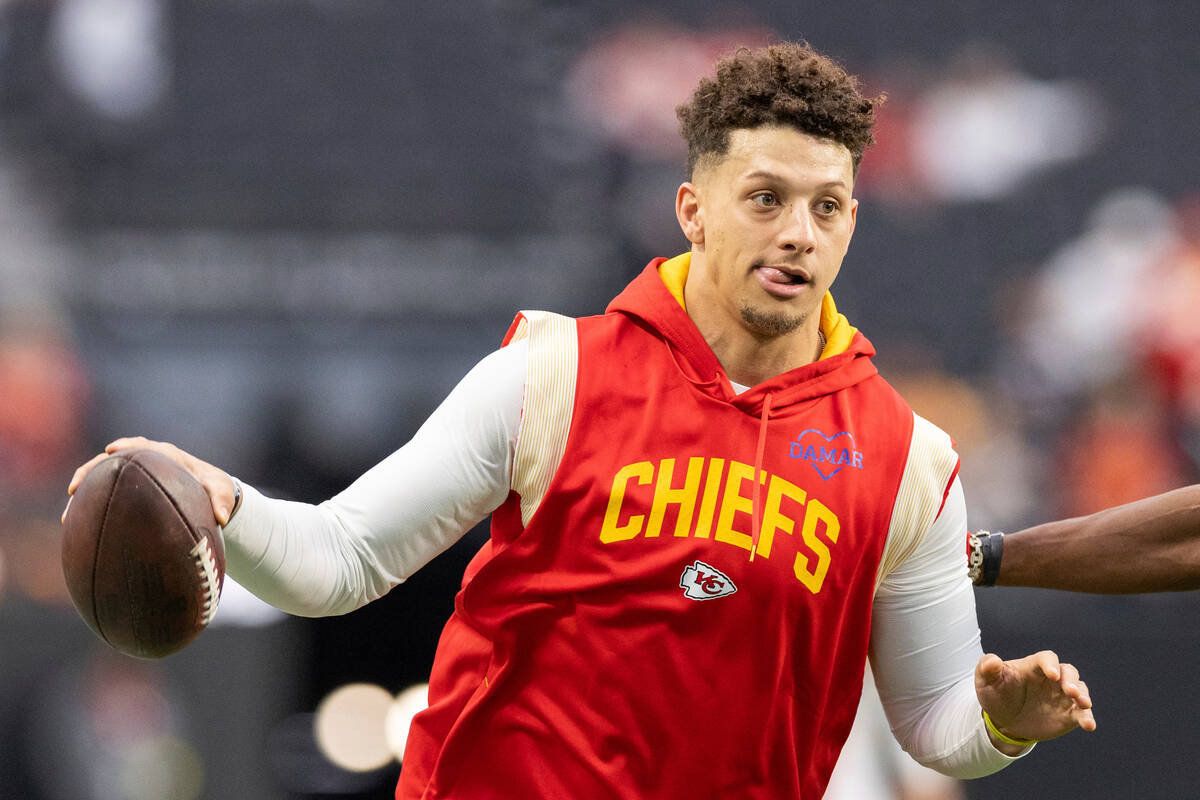 Kansas City Chiefs quarterback Patrick Mahomes (15) warms up wearing a Hamlin Strong sweatshirt ...