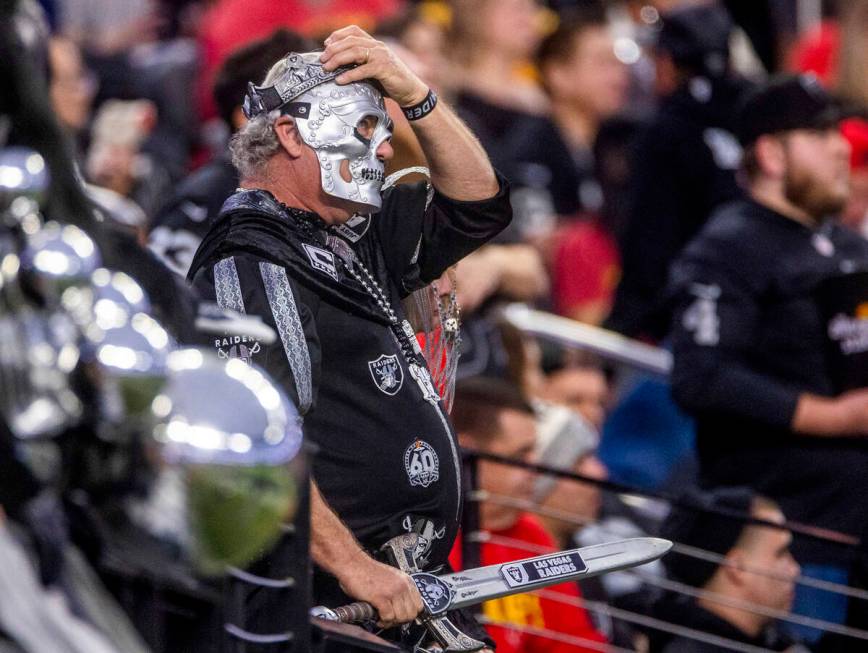A raiders fan looks on in dismay as the Kansas City Chiefs dominate during the second half of t ...