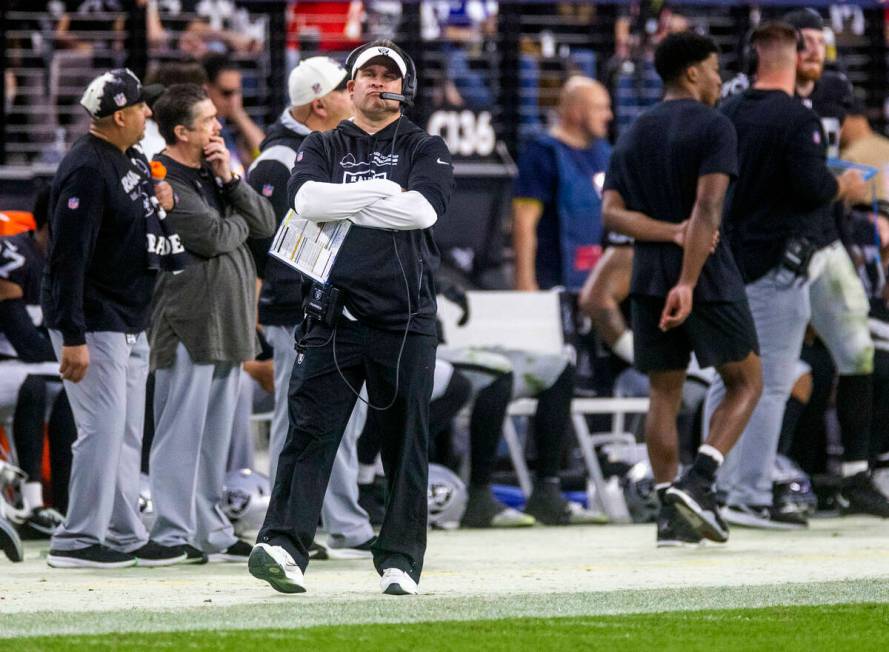 Raiders Head Coach Josh McDaniels pouts as he walks the sidelines versus the Kansas City Chiefs ...