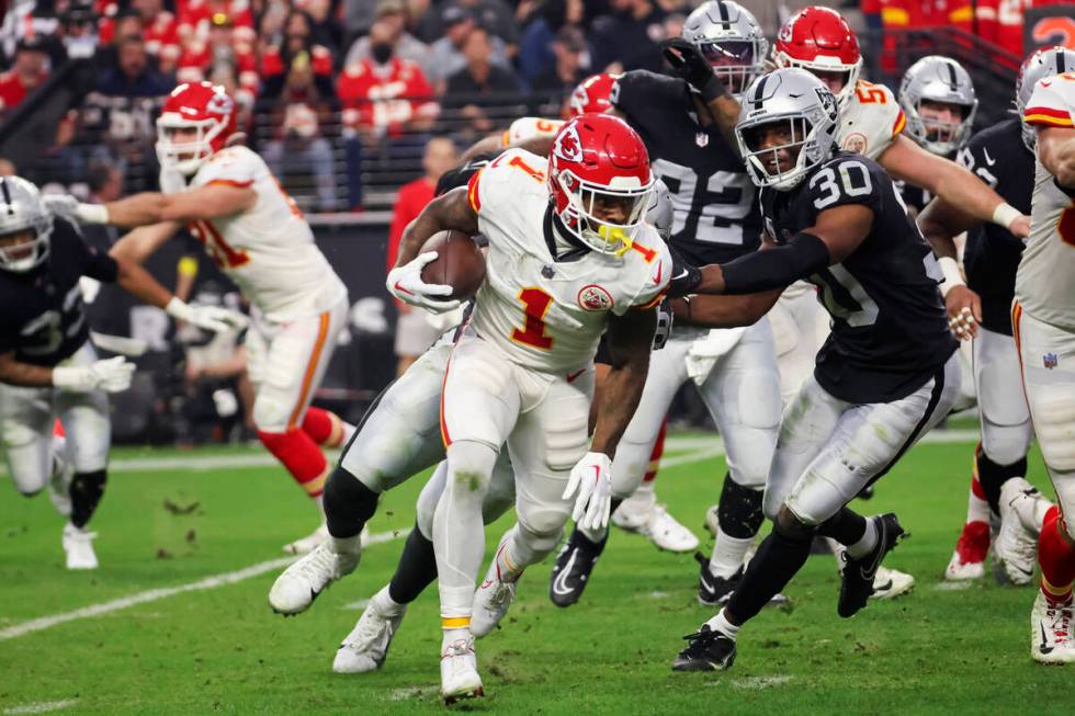 Kansas City Chiefs running back Jerick McKinnon (1) carries the ball against the Raiders during ...