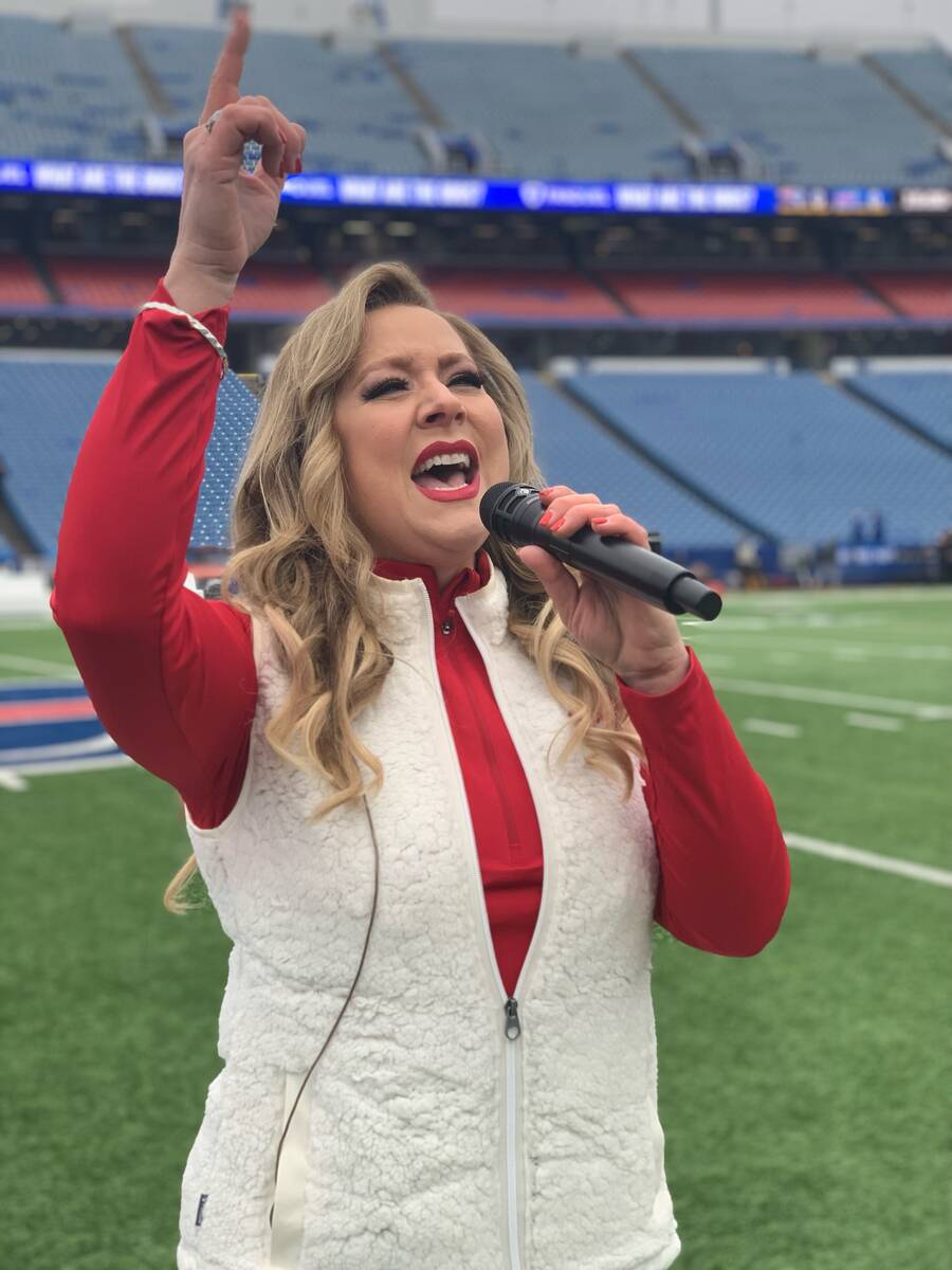 Las Vegas singer Janae Longo rehearses the national anthem at Highmark Stadium in Orchard Park, ...