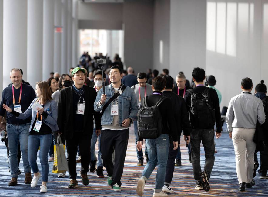 Attendees travel between halls during the CES tech show at the Las Vegas Convention Center on S ...