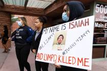 Latia Alexander, center, the mother of Isaiah Williams, Desiree Smith, left, and Kianna Grant, ...