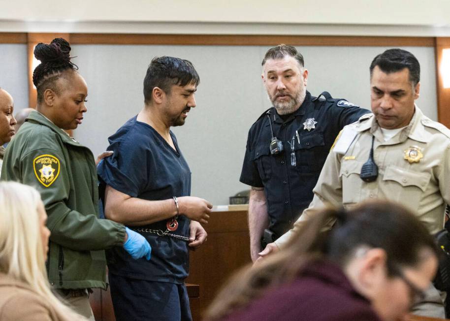 Mohammed Mesmarian, who is facing arson and terrorism charges, is led out of the courtroom afte ...