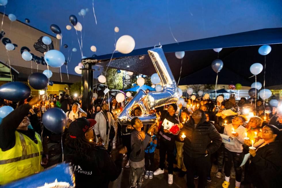 Balloons are released into the sky by family and friends during a celebration of life in memory ...