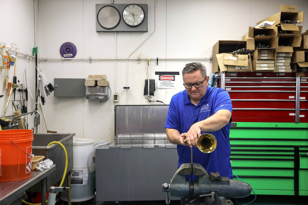 Cameron Gates, a musical instrument repair technician for the Clark County School District, rep ...