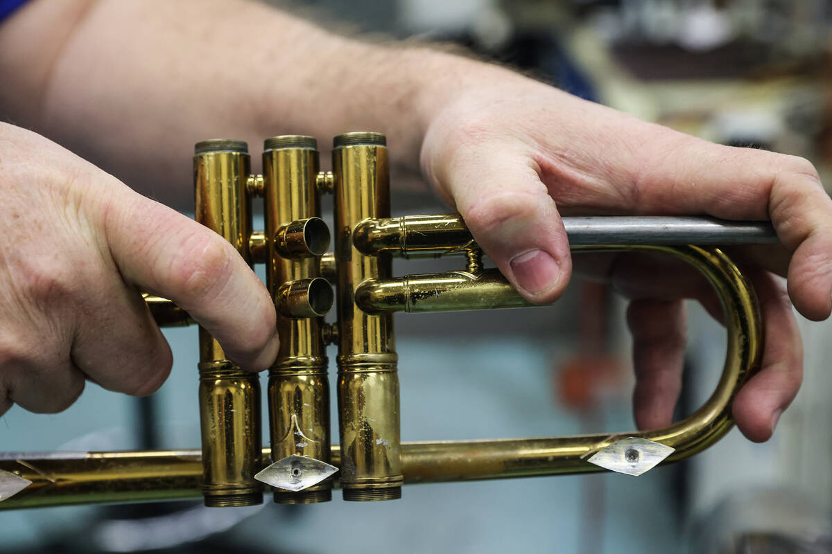 Cameron Gates, a musical instrument repair technician for the Clark County School District, rep ...