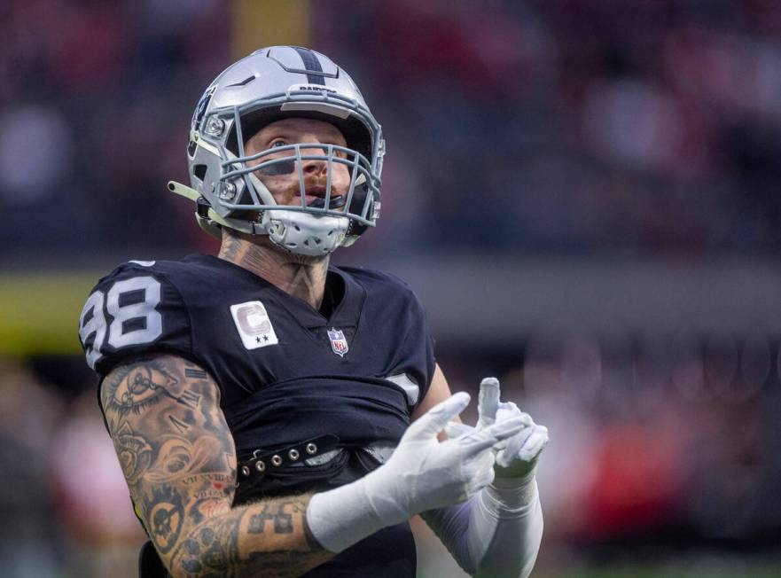 Raiders defensive end Maxx Crosby (98) counts while looking to the stands during warmups before ...