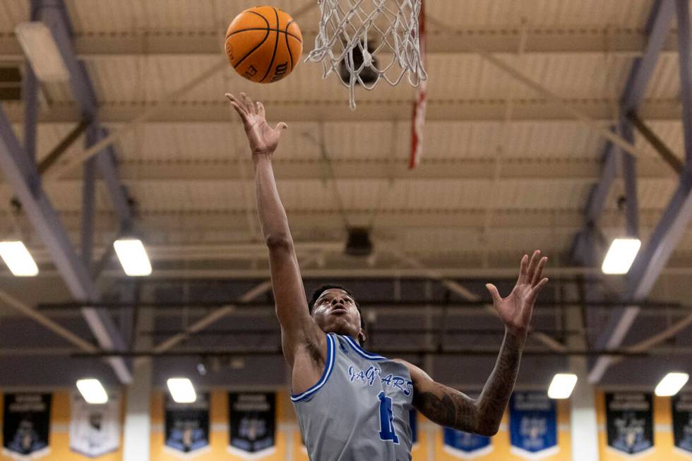 Desert Pines’ Evan Tatum (11) shoots during a boys high school basketball game against F ...