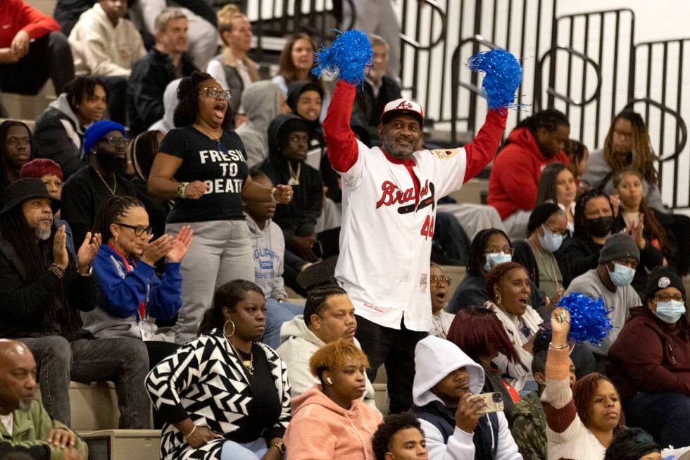 Desert Pines fans cheer for their team during a boys high school basketball game against Foothi ...