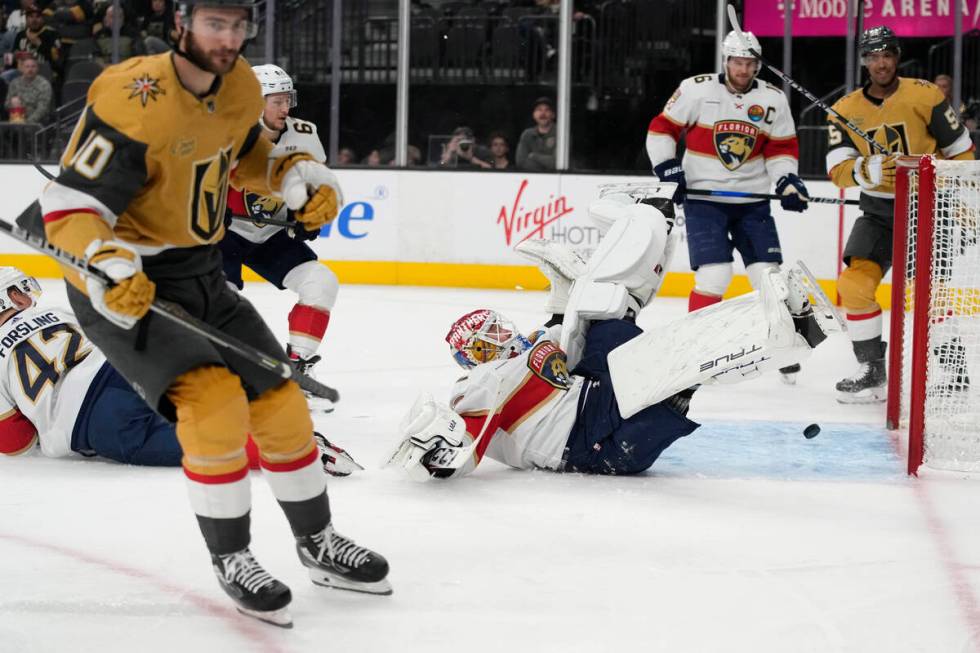 Vegas Golden Knights center Nicolas Roy (10) scores on Florida Panthers goaltender Sergei Bobro ...