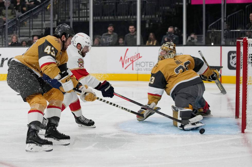 Florida Panthers defenseman Aaron Ekblad (5) attempts a shot on Vegas Golden Knights goaltender ...